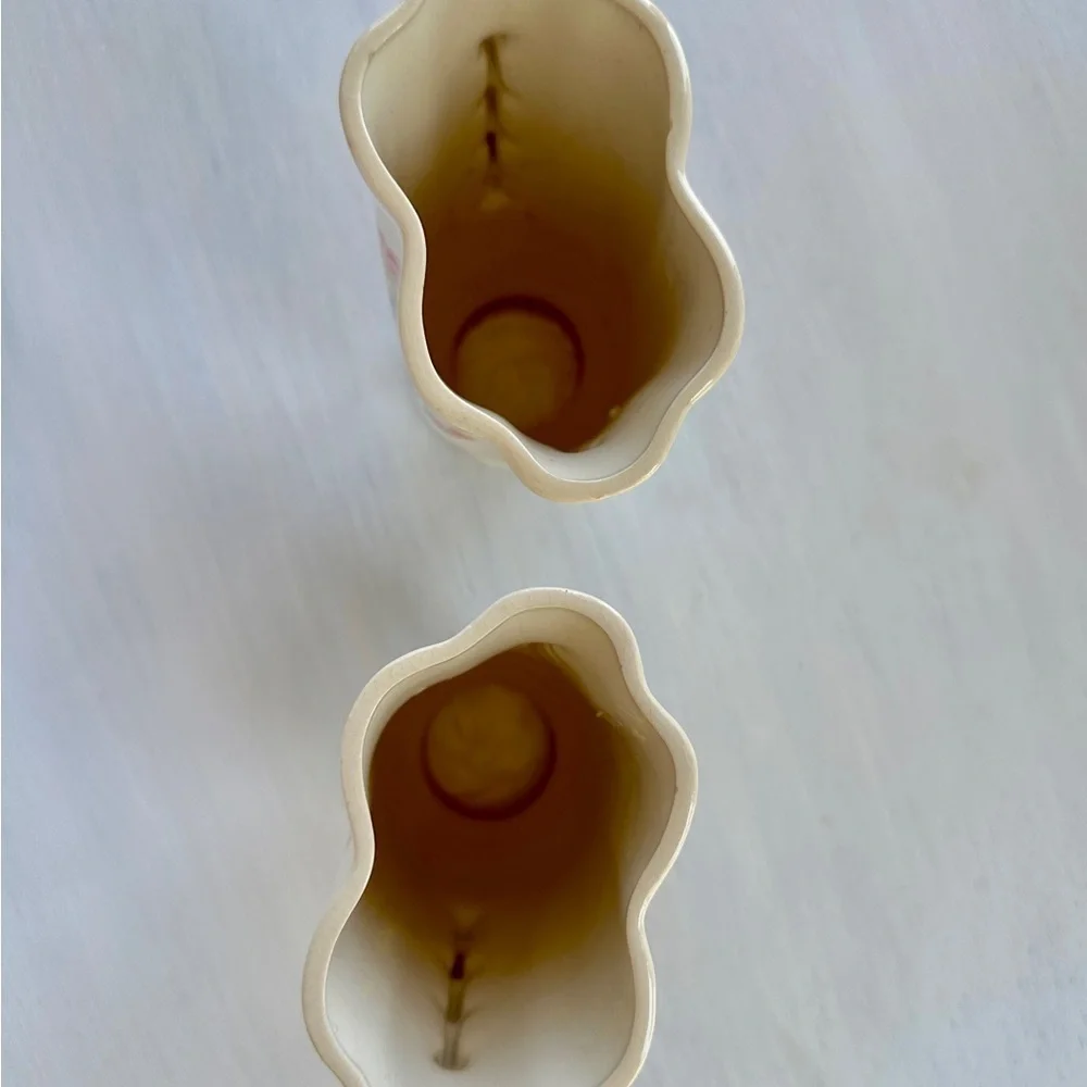 1950’S SET/2 , FLORAL VASES. SOFT CREAM COLOR WITH ONE SIDED FLORAL DESIGN.
